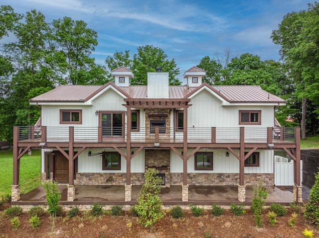 1224 Hangar Dr, Springfield, TN 37172 - rear view of property with stone siding, a chimney, a patio, and a balcony