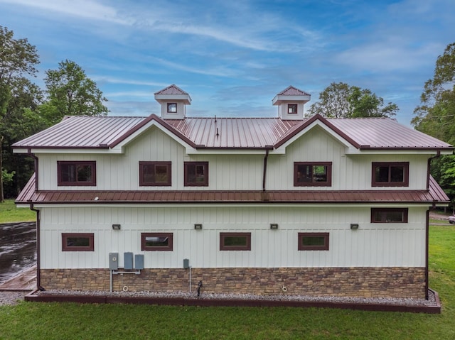 1224 Hangar Dr, Springfield, TN 37172 - rear view of house featuring a metal roof, board and batten siding, and stone siding