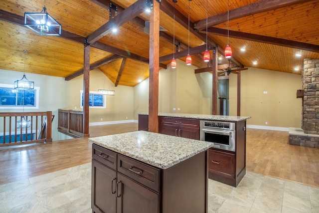 1224 Hangar Dr, Springfield, TN 37172 - kitchen featuring oven, open floor plan, wood ceiling, a center island, and light stone countertops