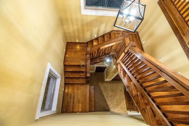 1224 Hangar Dr, Springfield, TN 37172 - staircase featuring a high ceiling and a chandelier
