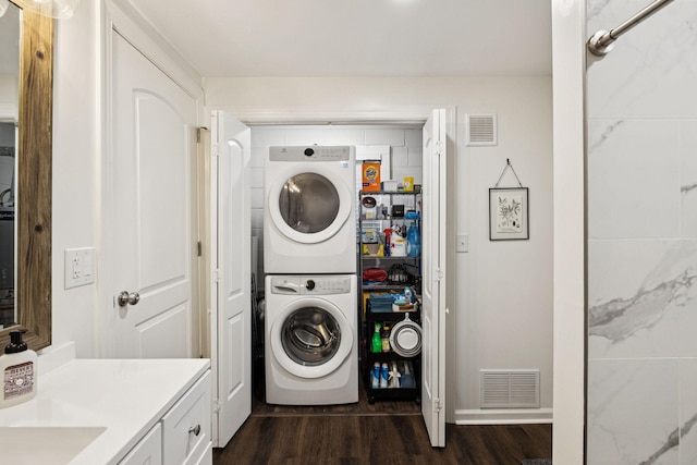 819 Woodside St, Columbia, TN 38401 - washroom with stacked washer / dryer and dark wood-style floors