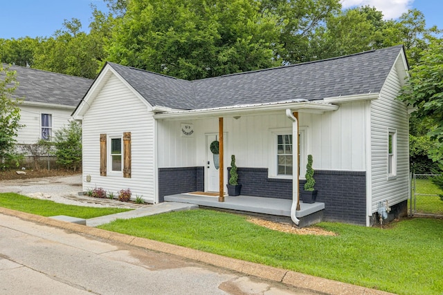 819 Woodside St, Columbia, TN 38401 - view of front of property with board and batten siding, roof with shingles, and covered porch