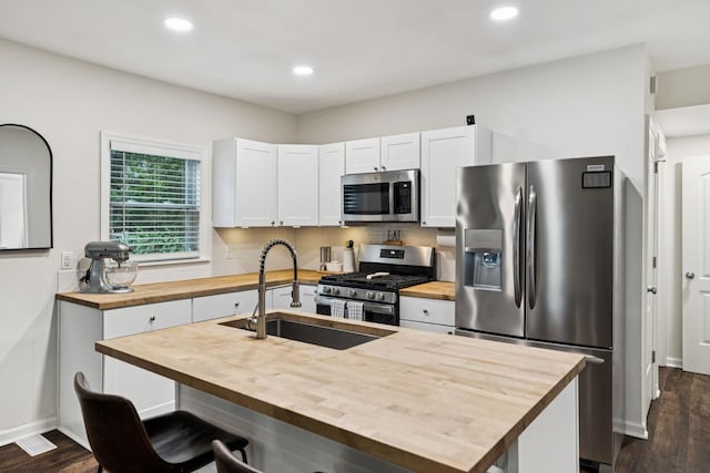 819 Woodside St, Columbia, TN 38401 - kitchen with butcher block counters, appliances with stainless steel finishes, dark wood finished floors, and recessed lighting