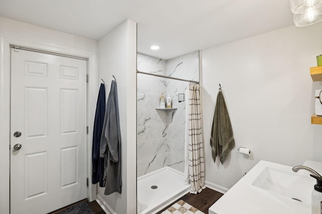 819 Woodside St, Columbia, TN 38401 - full bath with a marble finish shower, wood finished floors, vanity, and recessed lighting