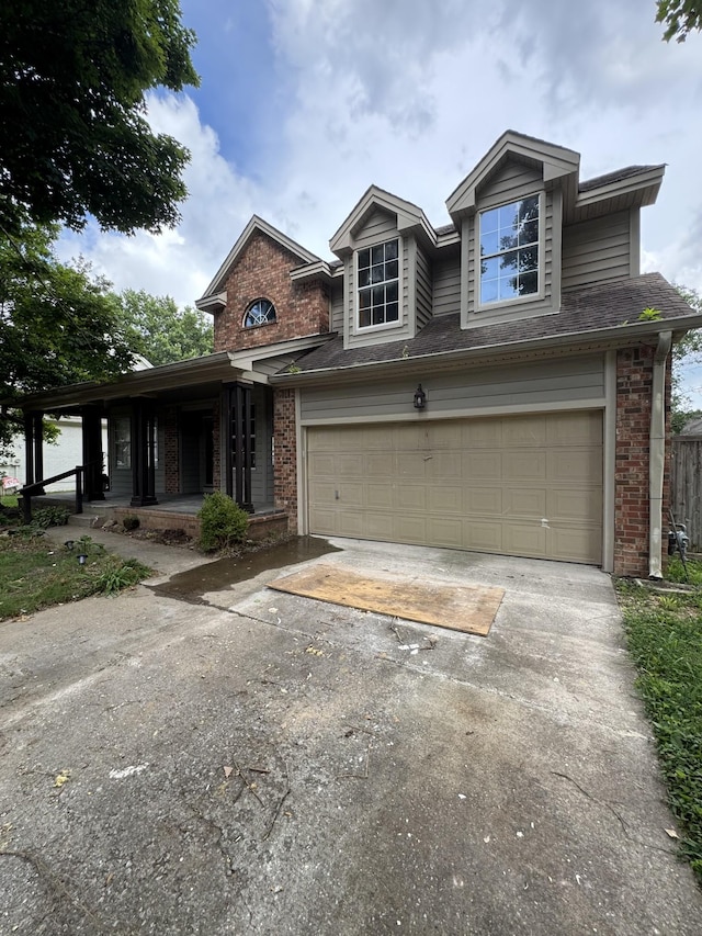 311 Park Glen Dr, Mount Juliet, TN 37122 - traditional-style home featuring brick siding, concrete driveway, covered porch, and an attached garage