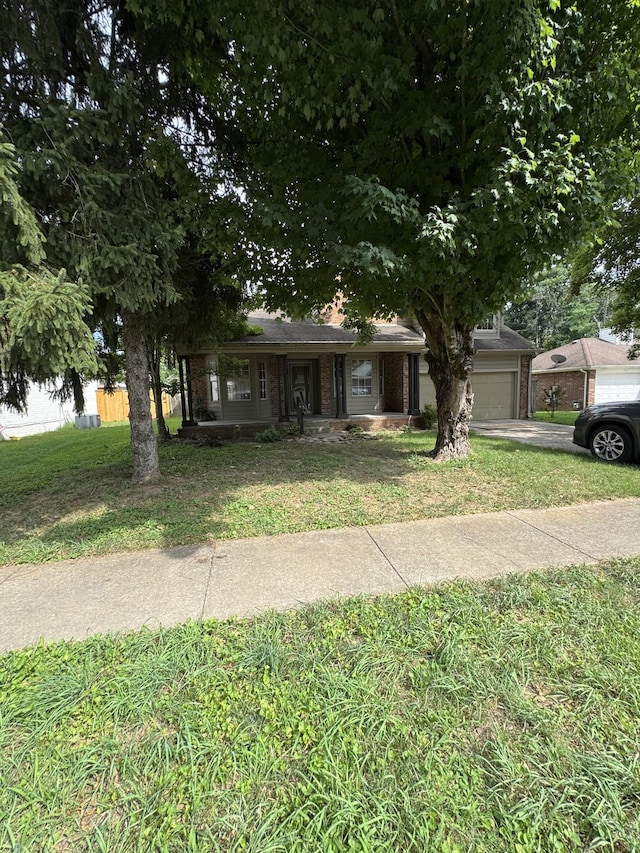 311 Park Glen Dr, Mount Juliet, TN 37122 - ranch-style house featuring brick siding, a garage, a front lawn, concrete driveway, and a porch