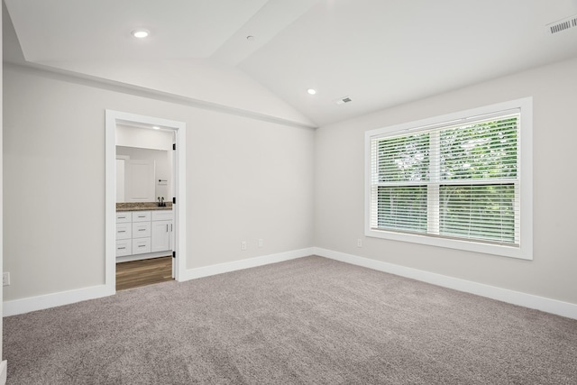4013 Norman Dr, Spring Hill, TN 37174 - unfurnished bedroom with carpet flooring, lofted ceiling, bar with sink, recessed lighting, and connected bathroom