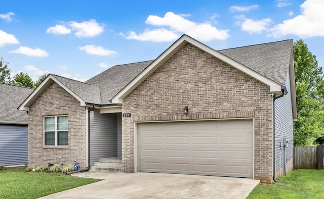 626 Snowshoe Ln, Clarksville, TN 37040 - ranch-style home with an attached garage, brick siding, concrete driveway, and roof with shingles
