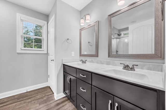 626 Snowshoe Ln, Clarksville, TN 37040 - bathroom with wood finished floors, double vanity, and an enclosed shower