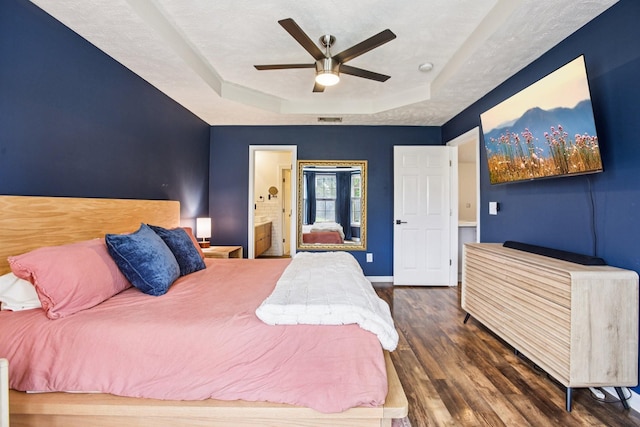 3315 Monoco Dr, Spring Hill, TN 37174 - bedroom with a raised ceiling, wood finished floors, connected bathroom, and a ceiling fan