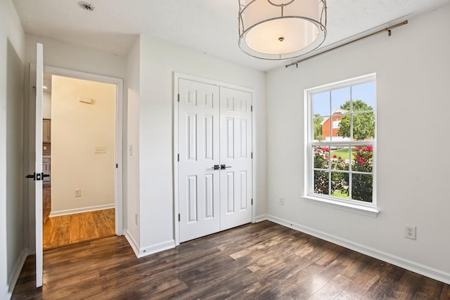3315 Monoco Dr, Spring Hill, TN 37174 - unfurnished bedroom featuring dark wood finished floors and a closet