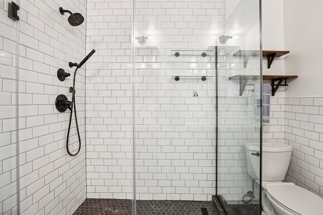 3315 Monoco Dr, Spring Hill, TN 37174 - bathroom featuring a stall shower, a wainscoted wall, and tile walls