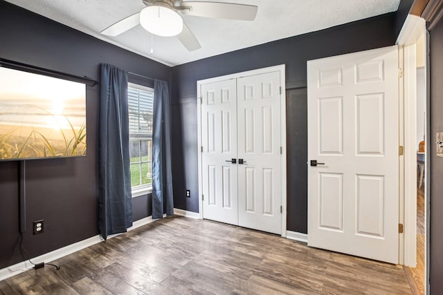 3315 Monoco Dr, Spring Hill, TN 37174 - unfurnished bedroom with a closet, wood finished floors, and ceiling fan
