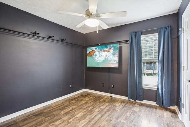 3315 Monoco Dr, Spring Hill, TN 37174 - empty room featuring wood finished floors, a ceiling fan, and a textured ceiling