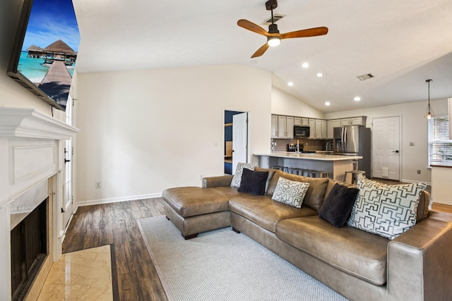 3315 Monoco Dr, Spring Hill, TN 37174 - living room with a premium fireplace, recessed lighting, lofted ceiling, ceiling fan, and wood finished floors