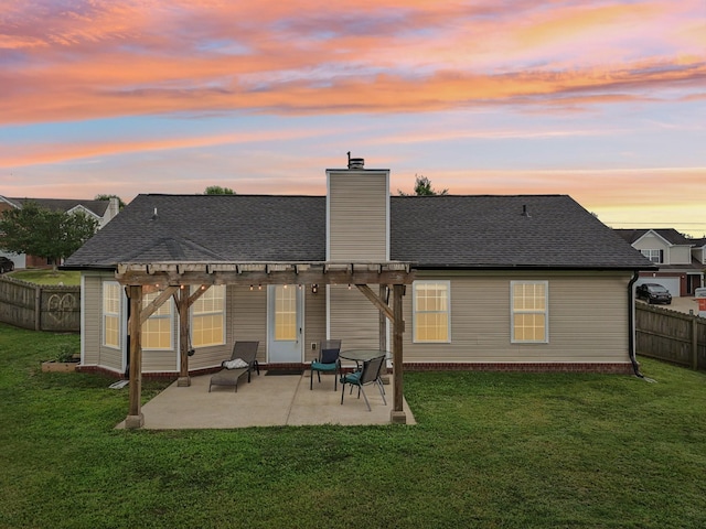 3315 Monoco Dr, Spring Hill, TN 37174 - back of property at dusk with a pergola, a chimney, a patio, and roof with shingles