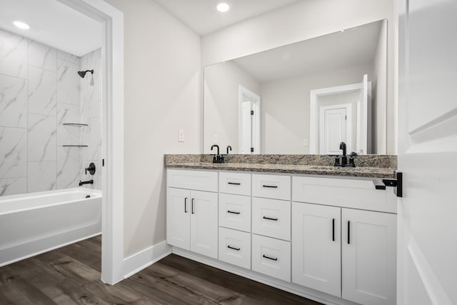 4005 Norman Dr, Spring Hill, TN 37174 - bathroom featuring double vanity, wood finished floors, washtub / shower combination, and recessed lighting