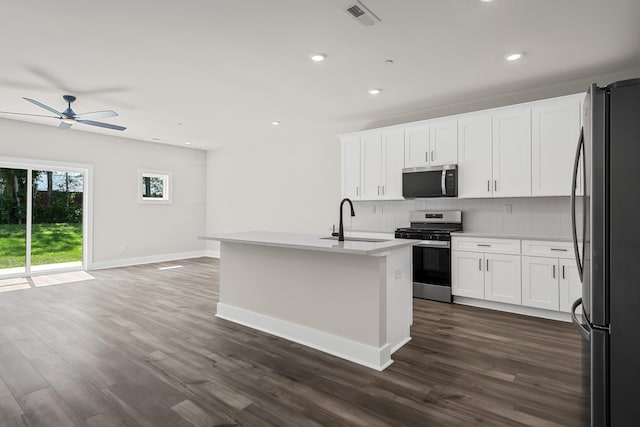 4005 Norman Dr, Spring Hill, TN 37174 - kitchen with appliances with stainless steel finishes, backsplash, a ceiling fan, dark wood-style flooring, and recessed lighting