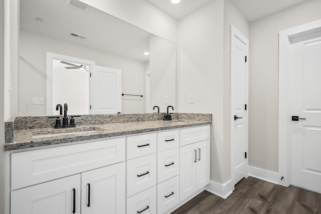 4005 Norman Dr, Spring Hill, TN 37174 - full bathroom featuring wood finished floors, double vanity, ceiling fan, and recessed lighting