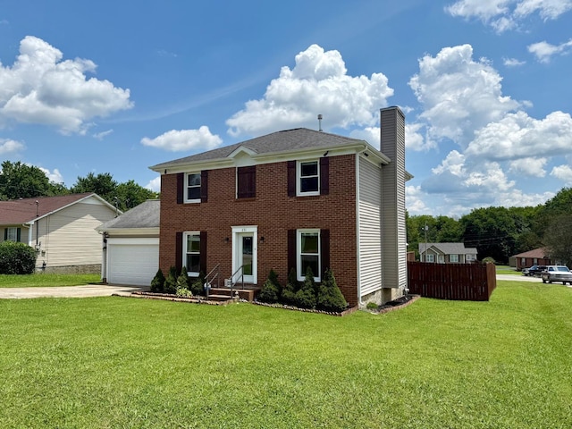 231 Overlook Pl, Columbia, TN 38401 - colonial house with a chimney, driveway, an attached garage, and brick siding