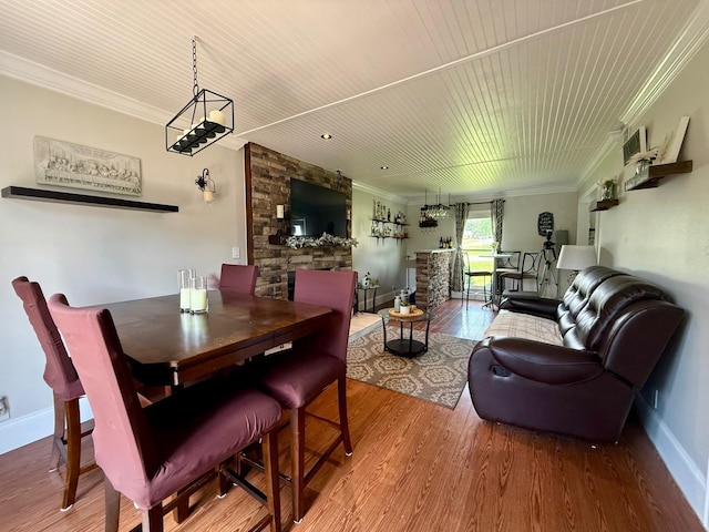 231 Overlook Pl, Columbia, TN 38401 - dining room with ornamental molding, wood finished floors, wood ceiling, and a fireplace