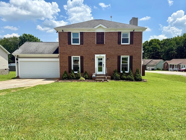 231 Overlook Pl, Columbia, TN 38401 - colonial inspired home with a chimney, a garage, driveway, a front yard, and brick siding