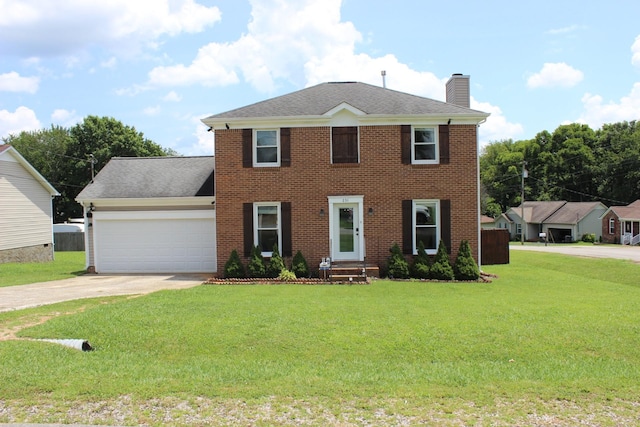 231 Overlook Pl, Columbia, TN 38401 - colonial house featuring a chimney, driveway, a garage, a front yard, and brick siding