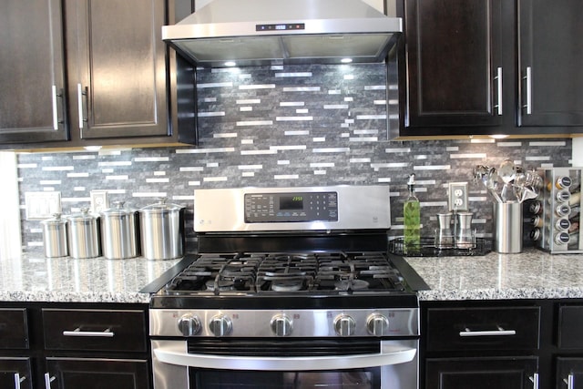 231 Overlook Pl, Columbia, TN 38401 - kitchen featuring stainless steel gas range, extractor fan, decorative backsplash, and light stone countertops