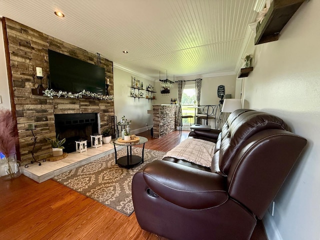 231 Overlook Pl, Columbia, TN 38401 - living area with wood finished floors, a stone fireplace, and crown molding
