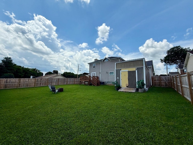 231 Overlook Pl, Columbia, TN 38401 - rear view of property with a fenced backyard, a storage unit, and a wooden deck