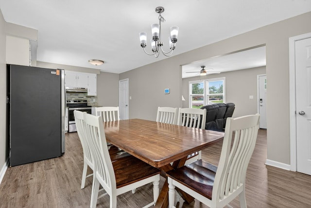 609 Chrisman Dr, Clarksville, TN 37042 - dining space featuring a chandelier, light wood-type flooring, and a ceiling fan