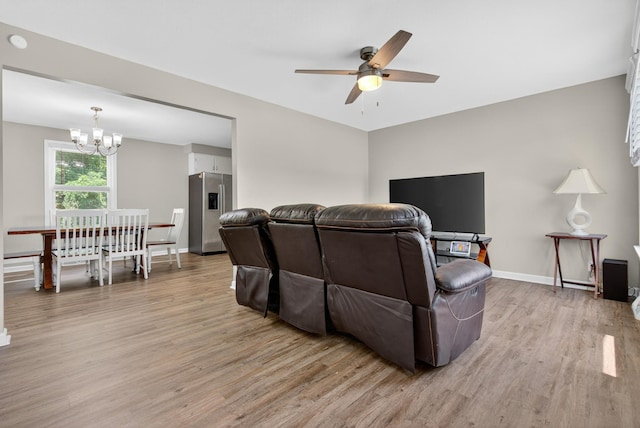 609 Chrisman Dr, Clarksville, TN 37042 - living area featuring light wood-type flooring, a chandelier, and a ceiling fan