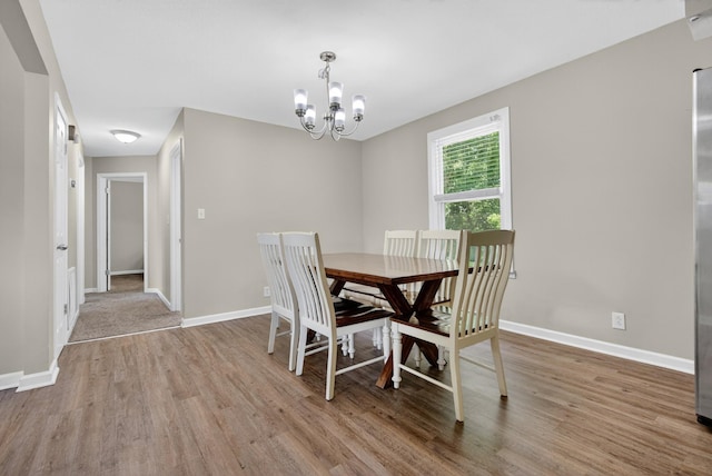 609 Chrisman Dr, Clarksville, TN 37042 - dining space with light wood-style floors and a chandelier