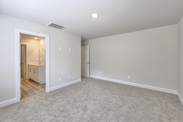 1753 Flora Grv, Hermitage, TN 37076 - unfurnished bedroom featuring light colored carpet and ensuite bathroom