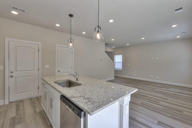 1753 Flora Grv, Hermitage, TN 37076 - kitchen with dishwasher, light wood-type flooring, white cabinets, a kitchen island with sink, and hanging light fixtures