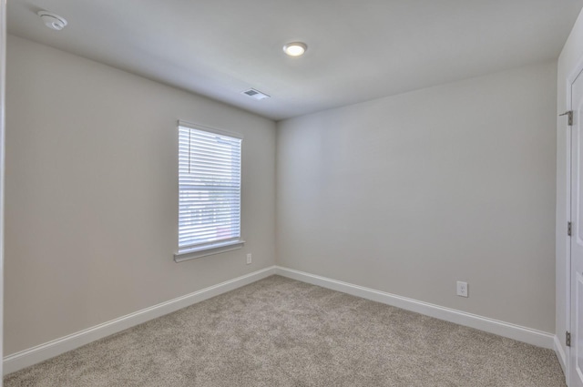 1753 Flora Grv, Hermitage, TN 37076 - carpeted spare room with baseboards and a smoke detector
