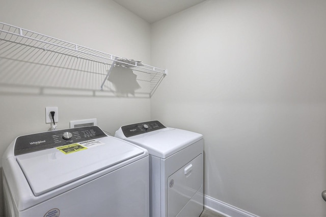1753 Flora Grv, Hermitage, TN 37076 - laundry area featuring separate washer and dryer and baseboards