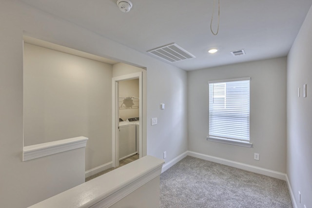 1753 Flora Grv, Hermitage, TN 37076 - empty room featuring washing machine and clothes dryer, a smoke detector, and carpet