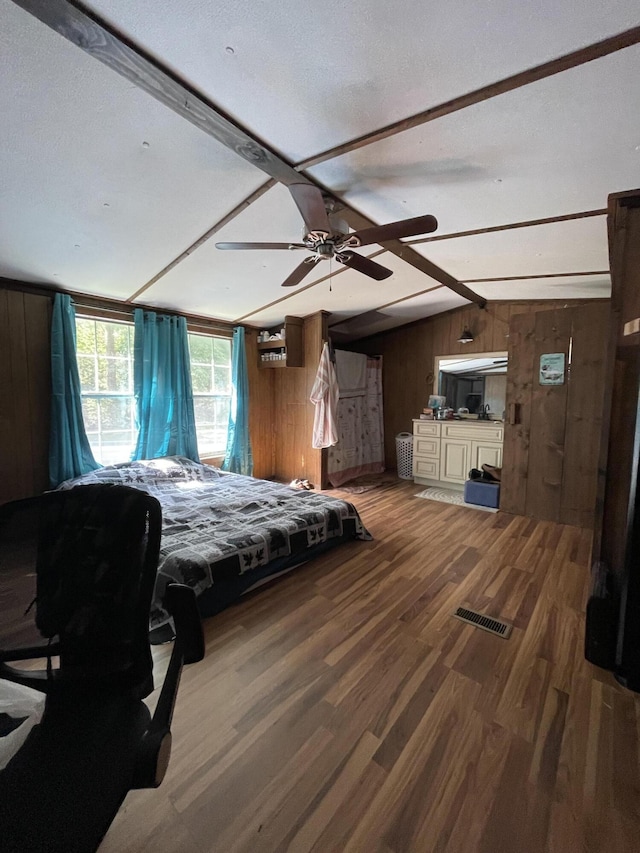 3406 Lowes Gap Rd, Pikeville, TN 37367 - bedroom featuring wooden walls, wood finished floors, and vaulted ceiling