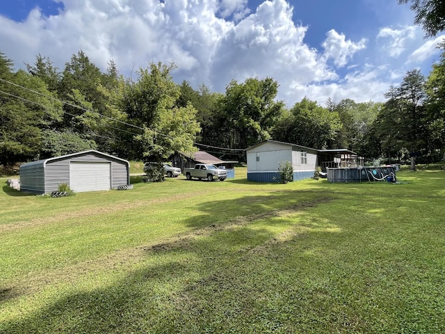 3406 Lowes Gap Rd, Pikeville, TN 37367 - view of grassy yard with a garage, an outdoor structure, and view of scattered trees