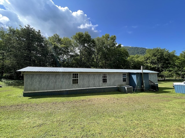 3406 Lowes Gap Rd, Pikeville, TN 37367 - back of property featuring a yard