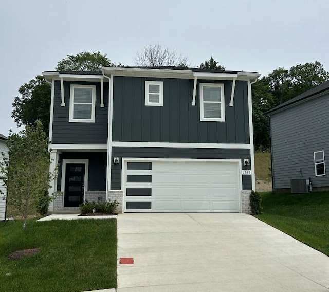 1770 Flora Grv, Hermitage, TN 37076 - view of front facade featuring an attached garage, board and batten siding, driveway, a front yard, and brick siding