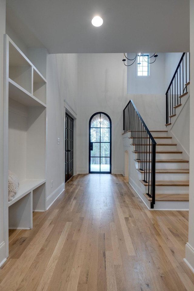 1050 Garton Rd, Burns, TN 37029 - mudroom with a chandelier, plenty of natural light, wood finished floors, and a high ceiling