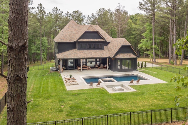 1050 Garton Rd, Burns, TN 37029 - back of property with a fenced backyard, roof with shingles, a patio, and an in-ground hot tub
