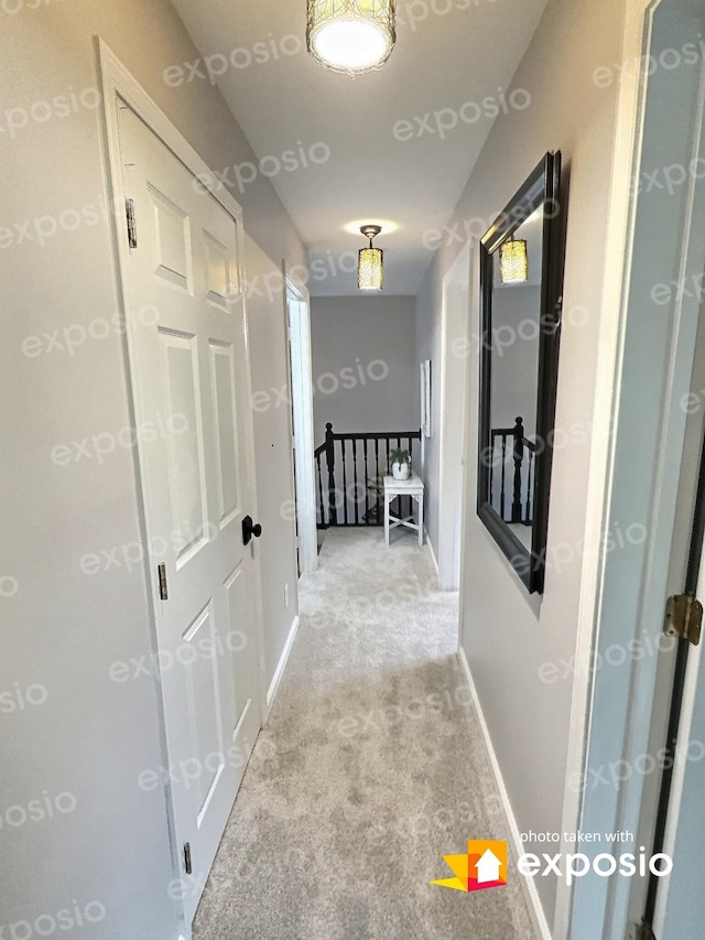 4417 Jackson Hollow Rd, Franklin, TN 37064 - hall with light carpet and an upstairs landing