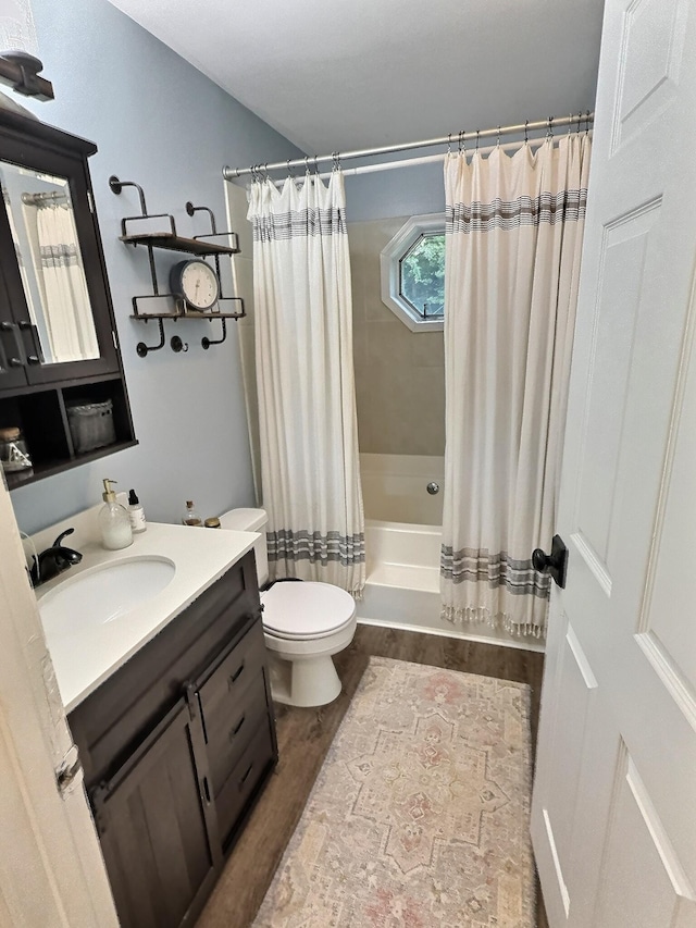 4417 Jackson Hollow Rd, Franklin, TN 37064 - bathroom featuring vanity, shower / tub combo with curtain, and wood finished floors