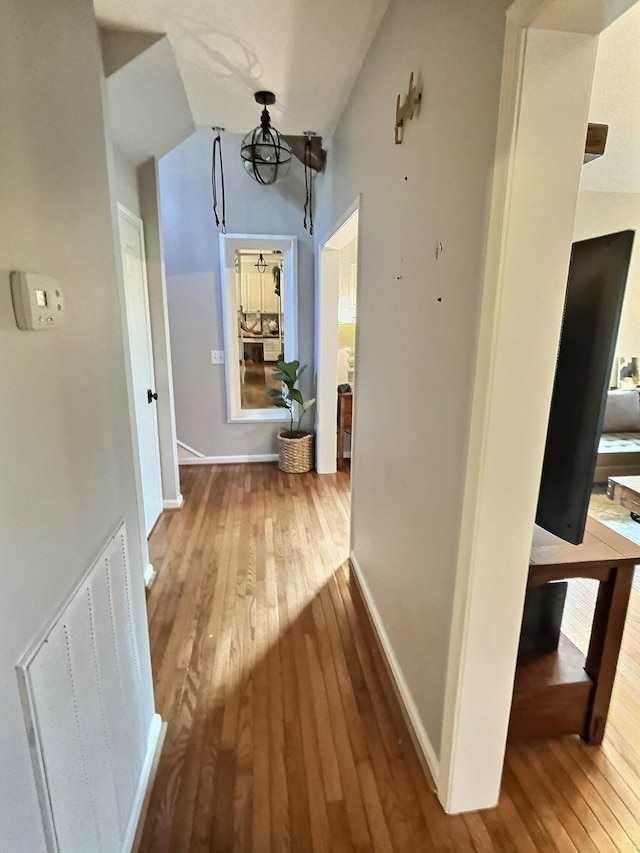 4417 Jackson Hollow Rd, Franklin, TN 37064 - corridor with wood-type flooring and a chandelier