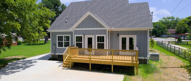 570 Main St S, Ashland City, TN 37015 - back of house featuring board and batten siding, a wooden deck, a shingled roof, and french doors