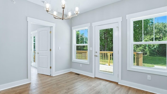 570 Main St S, Ashland City, TN 37015 - doorway featuring a chandelier, plenty of natural light, and wood finished floors