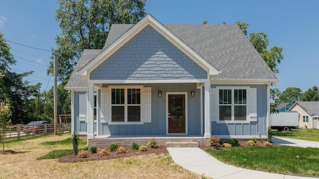 570 Main St S, Ashland City, TN 37015 - view of front of property featuring board and batten siding, a porch, and roof with shingles